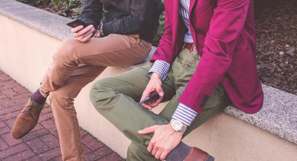 Image of basic clothing items in connected colors with a subtle accent piece