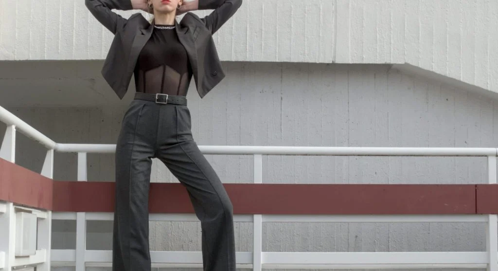 Woman wearing fine knit top and cropped trousers for seasonal change