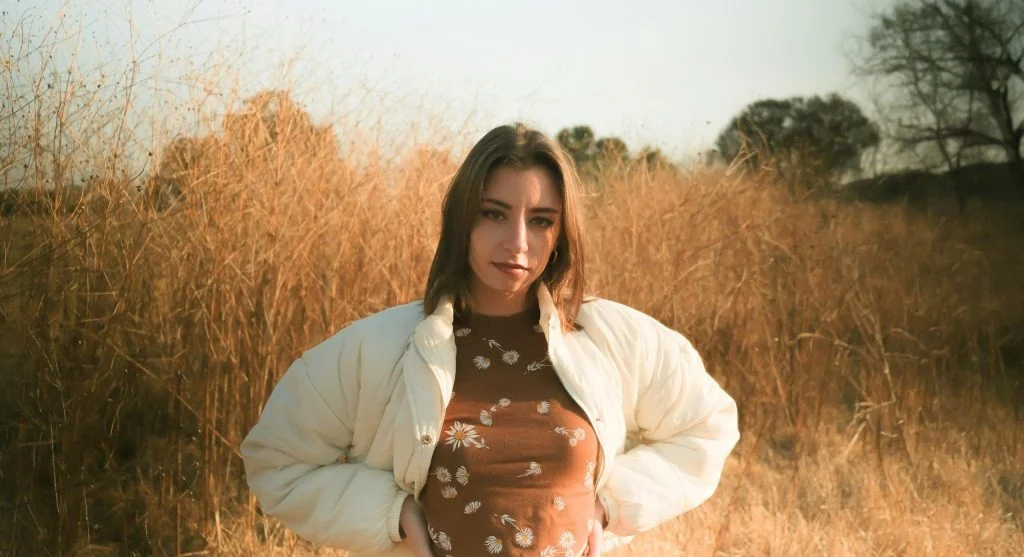 Woman wearing a simple base outfit with seasonal accessories
