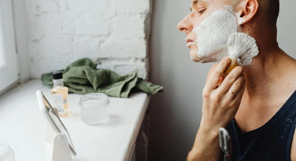 Clean grooming tools and self-care products on a table