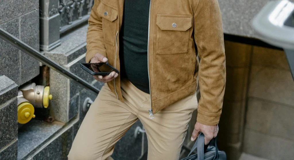 Man wearing ill-fitting jacket and trousers