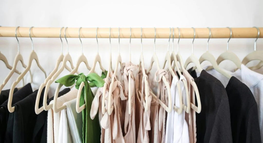 Stylish outfit featuring neutral colored clothing with pops of color