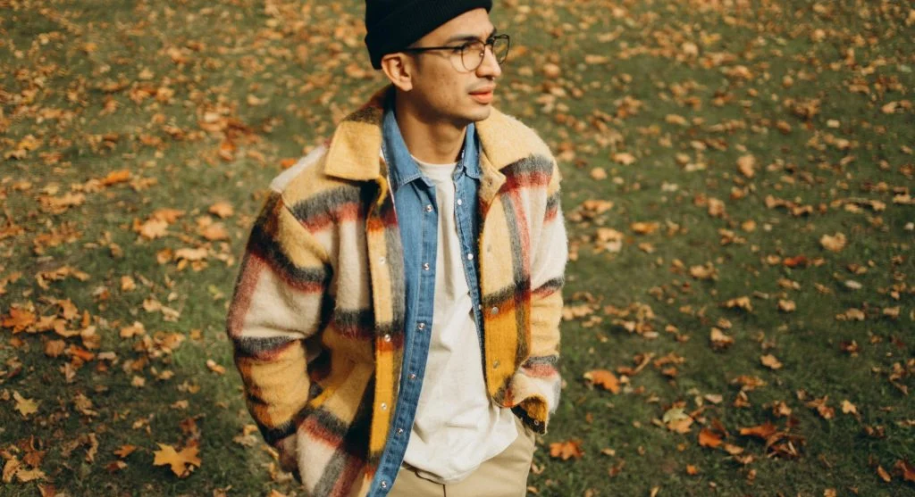 Seasonal outerwear for men and women, including jackets, coats, and scarves