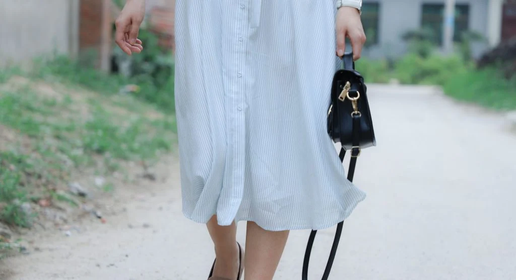 Softly structured bag compared with a rigid handbag in the same everyday outfit