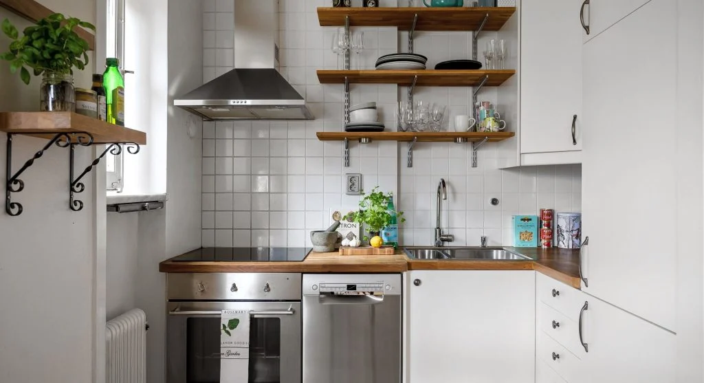 Small midweek reset improving kitchen and entryway before clutter grows larger