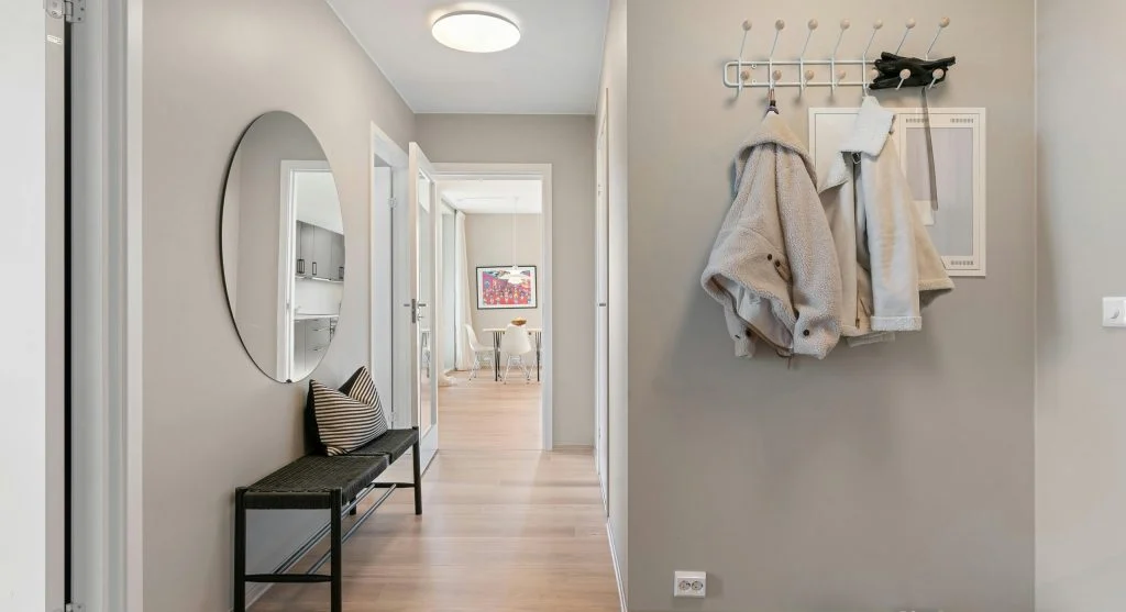 Landing spot near the door being used for everyday essentials after coming home