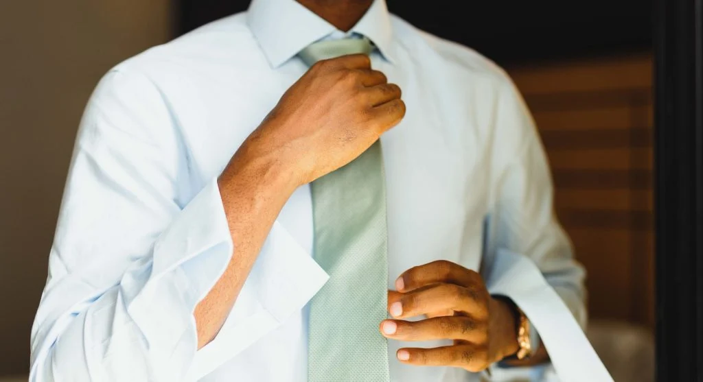 Cleaner sleeve line created by crisp shirt cuffs in a basic polished outfit