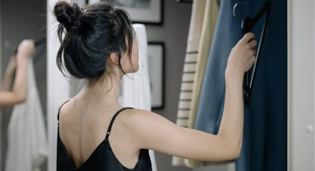 Three-outfit backup plan grouped together inside a wardrobe for quick weekday dressing