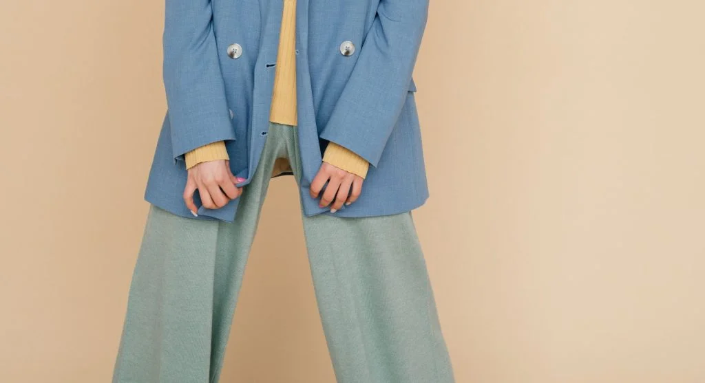 Outfit repetition myths shown through a clean repeated look compared with an overworked version