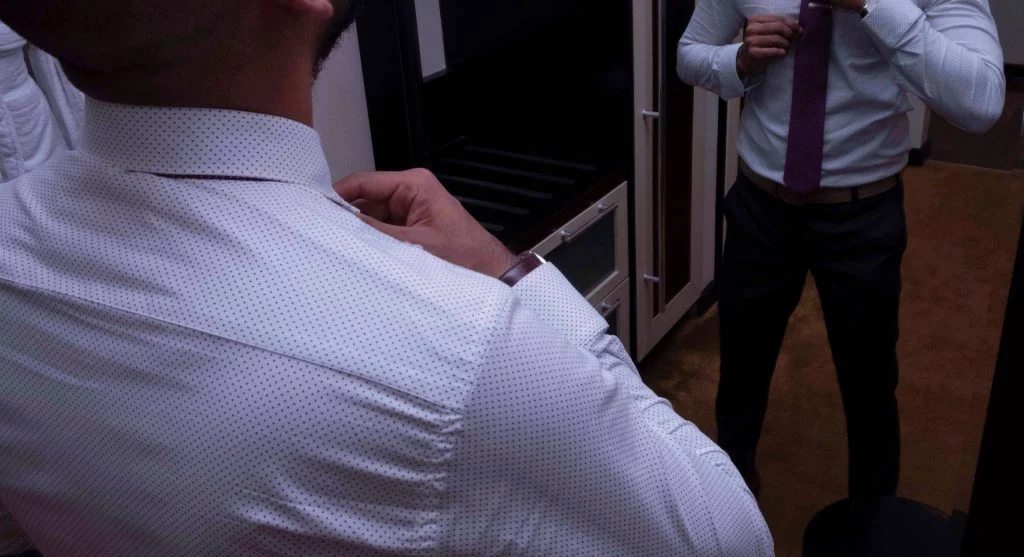 Cleaner break between top and bottom compared with a less defined everyday outfit transition