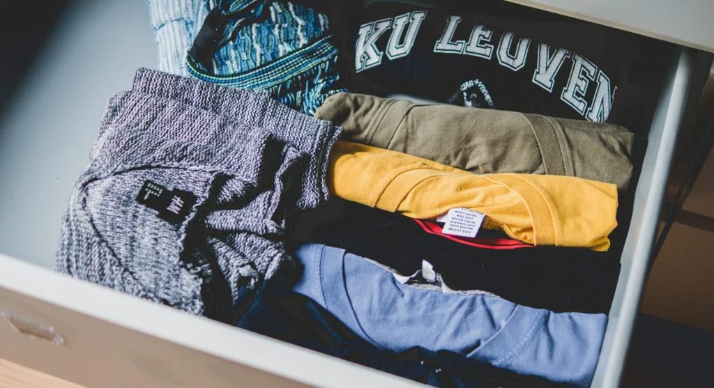 Small outfit pairing shelf arranged with useful repeat-wear clothing partners
